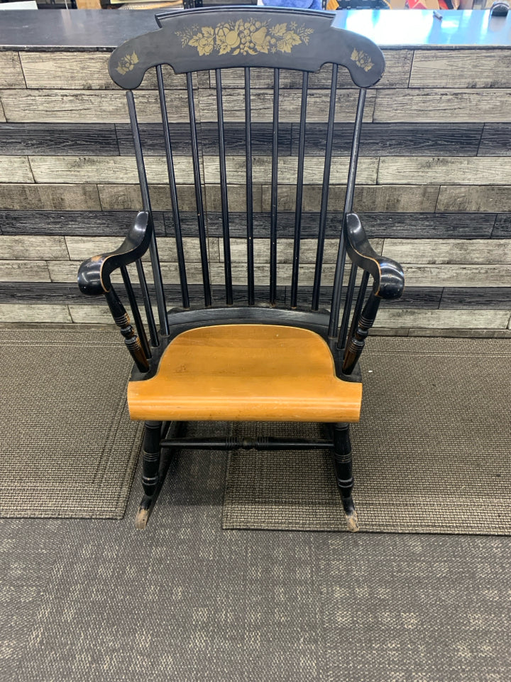 BLACK WOOD ROCKING CHAIR W FRUIT DETAILING.