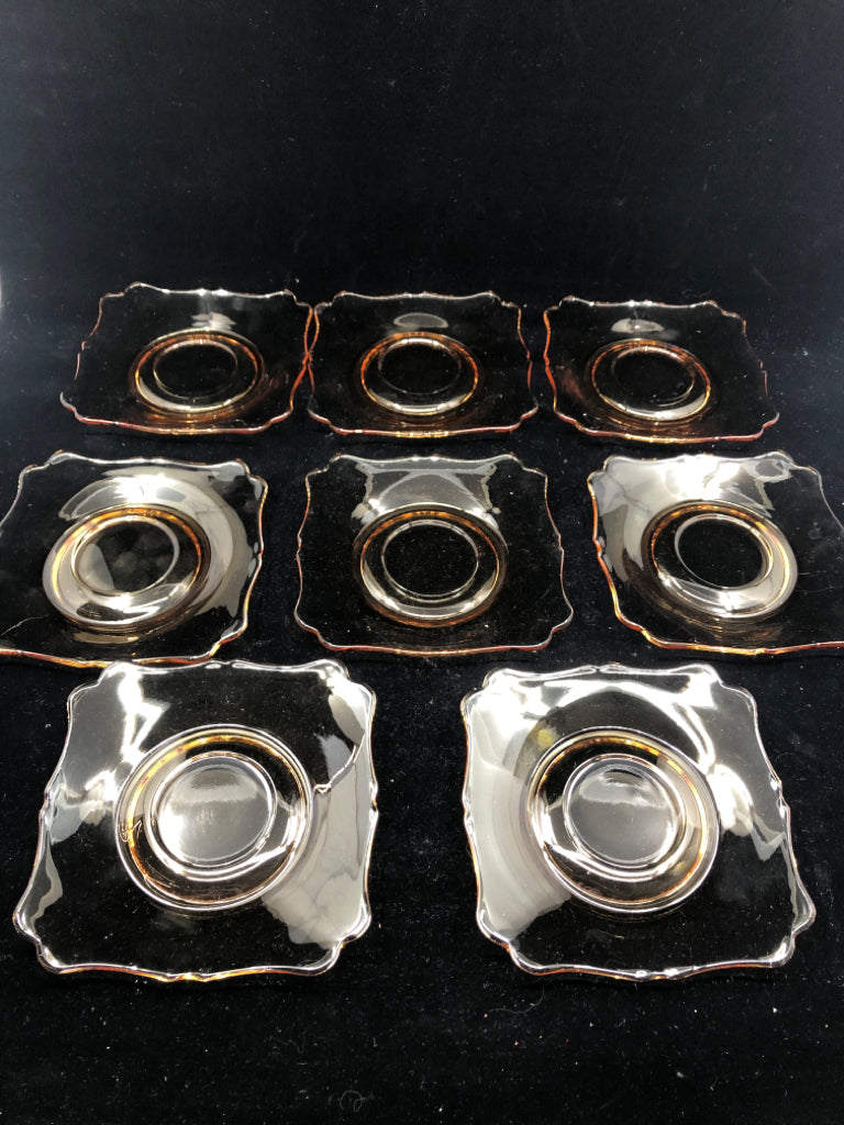 8 AMBER GLASS TEA CUPS AND SAUCERS.