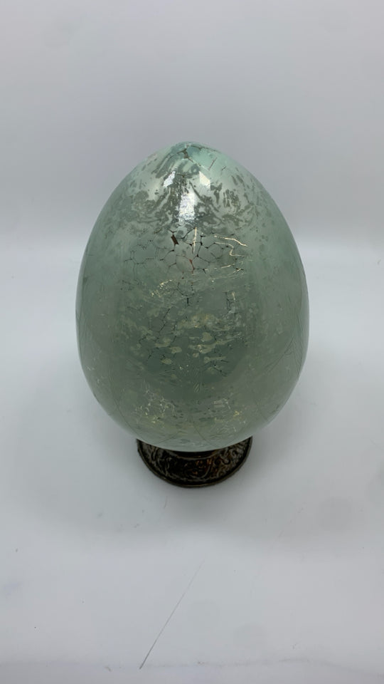 IRIDESCENT BLUE EGG ON SILVER SHELF DECOR.