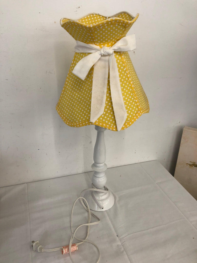 WHITE BASE LAMP W YELLOW SHADE.