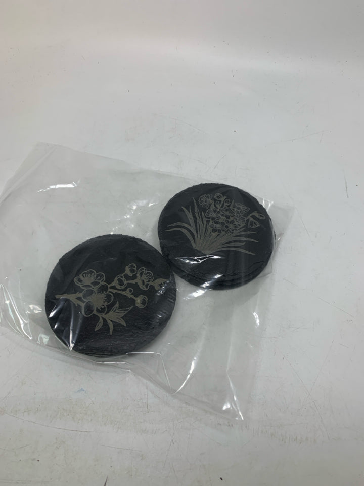 6 CIRCLE SLATE FLOWER DETAILED COASTERS IN BAG.