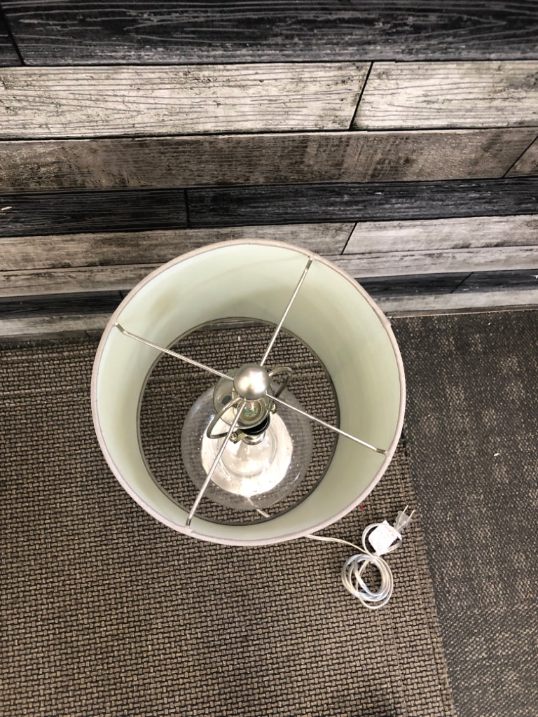 GLASS ROUND BASE LAMP WITH GREEN SHADE.