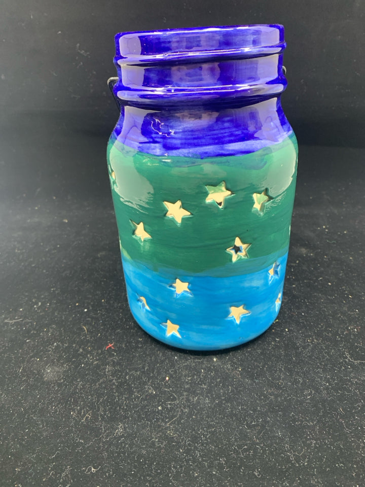 PAINTED STAR CUTOUT LANTERN.