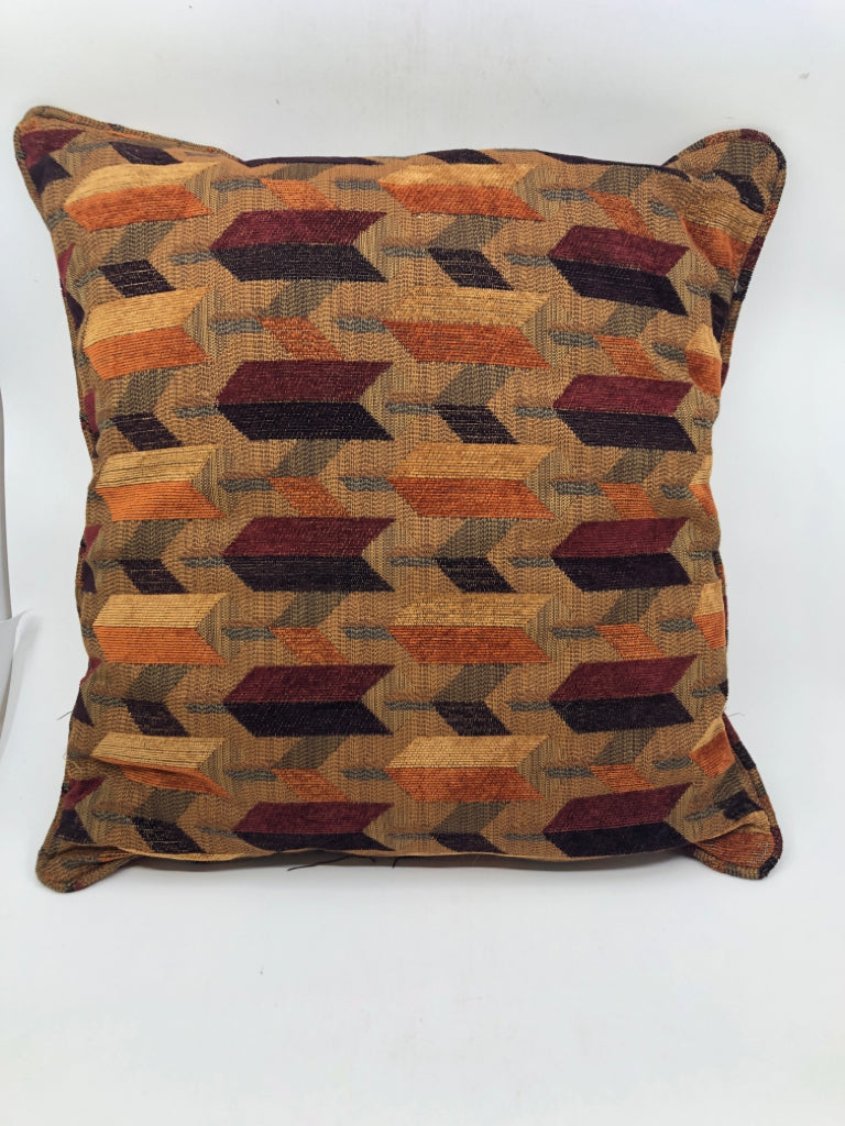 ORANGE AND BROWN PATTERN PILLOW.