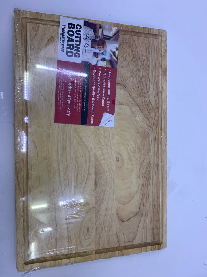 NIP WOOD CUTTING BOARD.