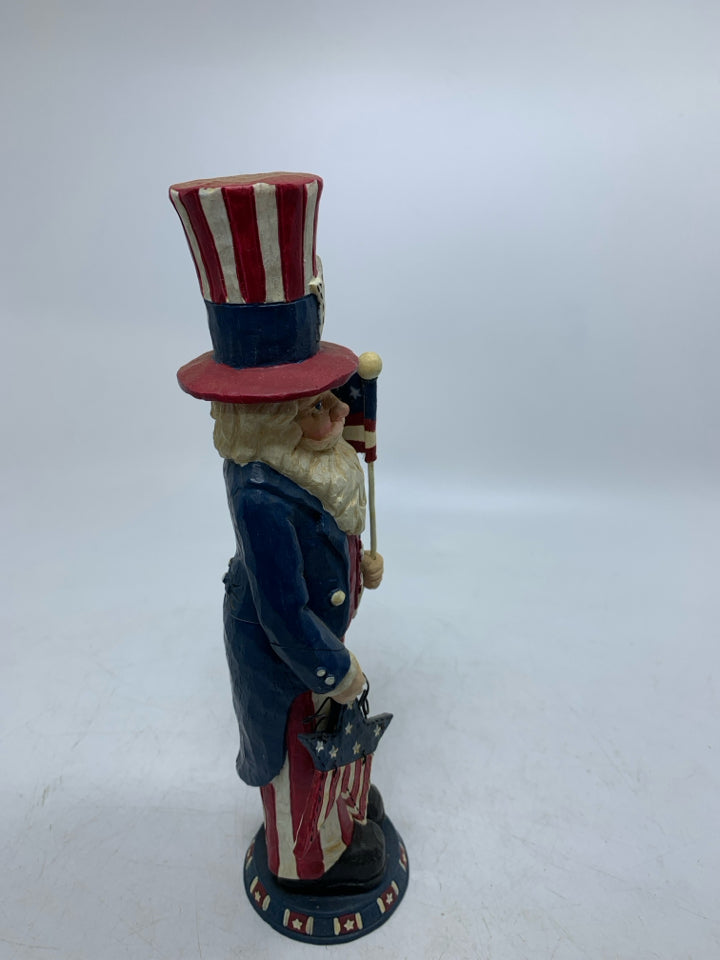 RESIN PATRIOTIC THEMED MAN HOLDING STAR/FLAG.