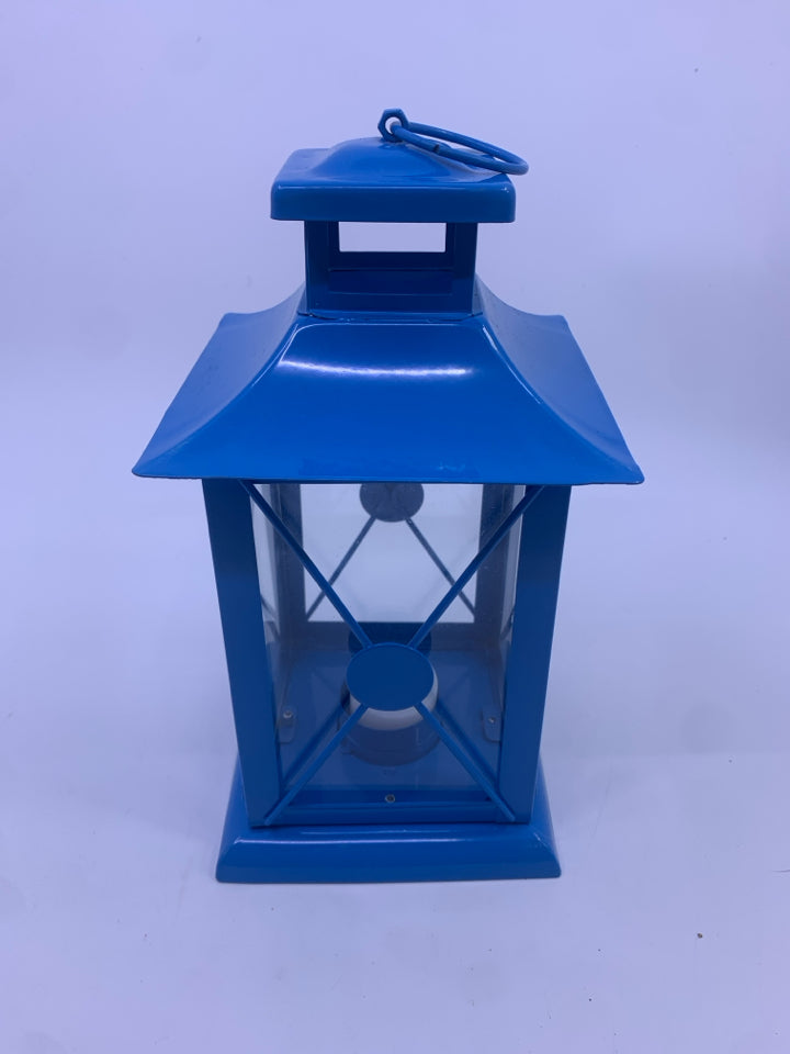 BLUE METAL TEA LIGHT LANTERN.