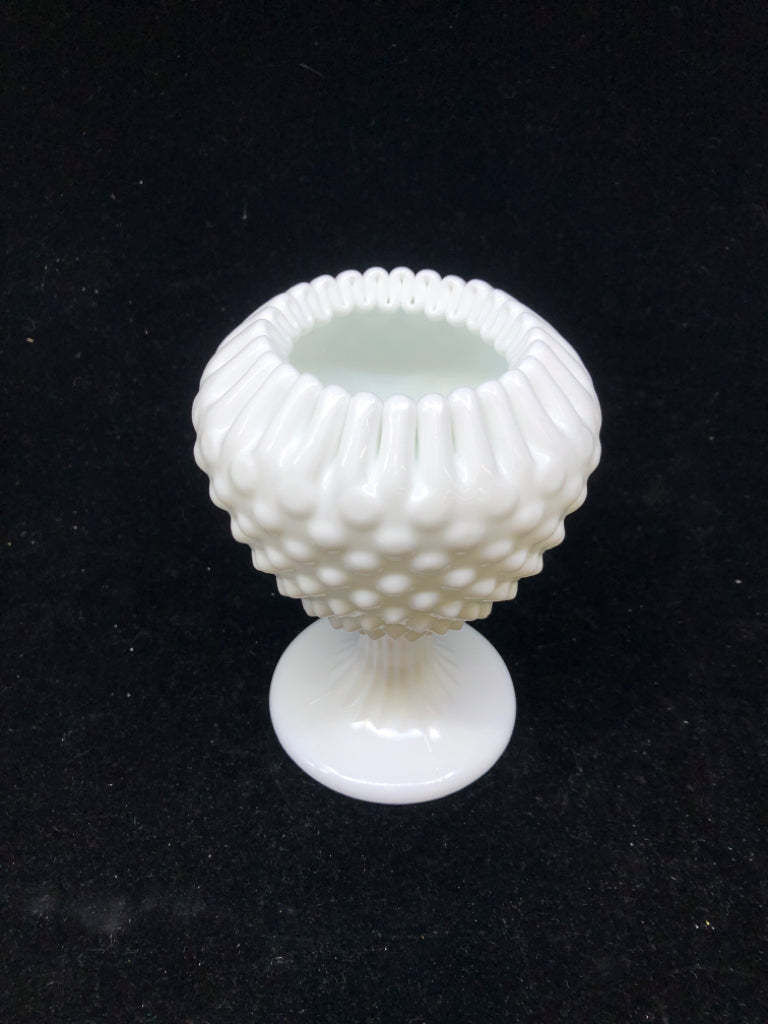 FOOTED MILK GLASS VASE W PINCHED RIM.