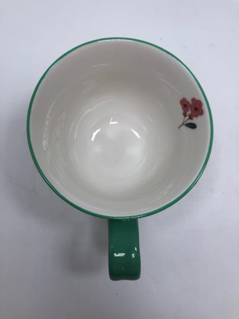 GREEN FLORAL FOOTED MUG.