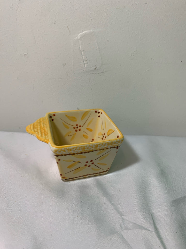 YELLOW TEMPTATIONS SMALL SQUARE BOWL ONE HANDLE.