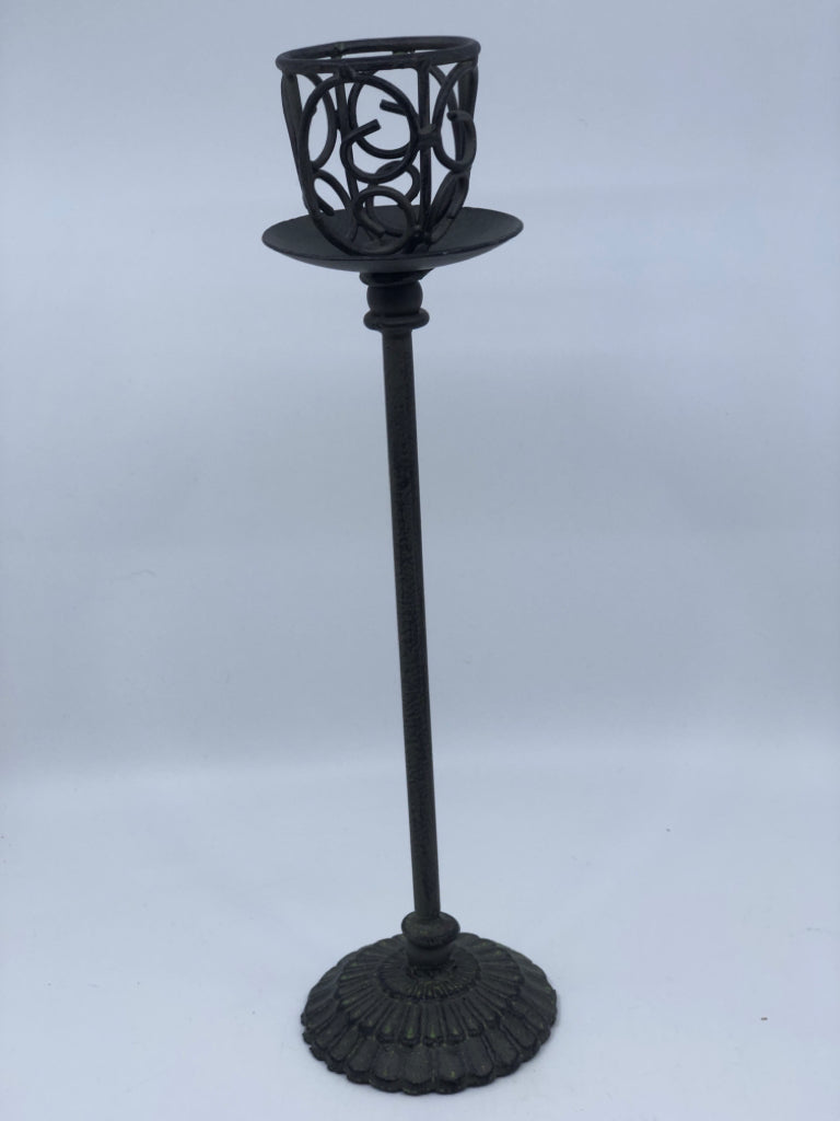 TALL GRAY METAL CUTOUT CANDLE HOLDER.