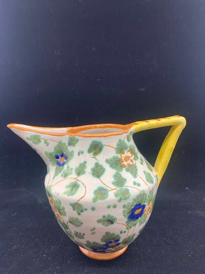 PAINTED UNIQUE PITCHER W YELLOW HANDLE.