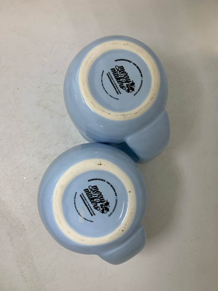 2 LIGHT BLUE MUGS W/ SNOWFLAKE IN CENTER.