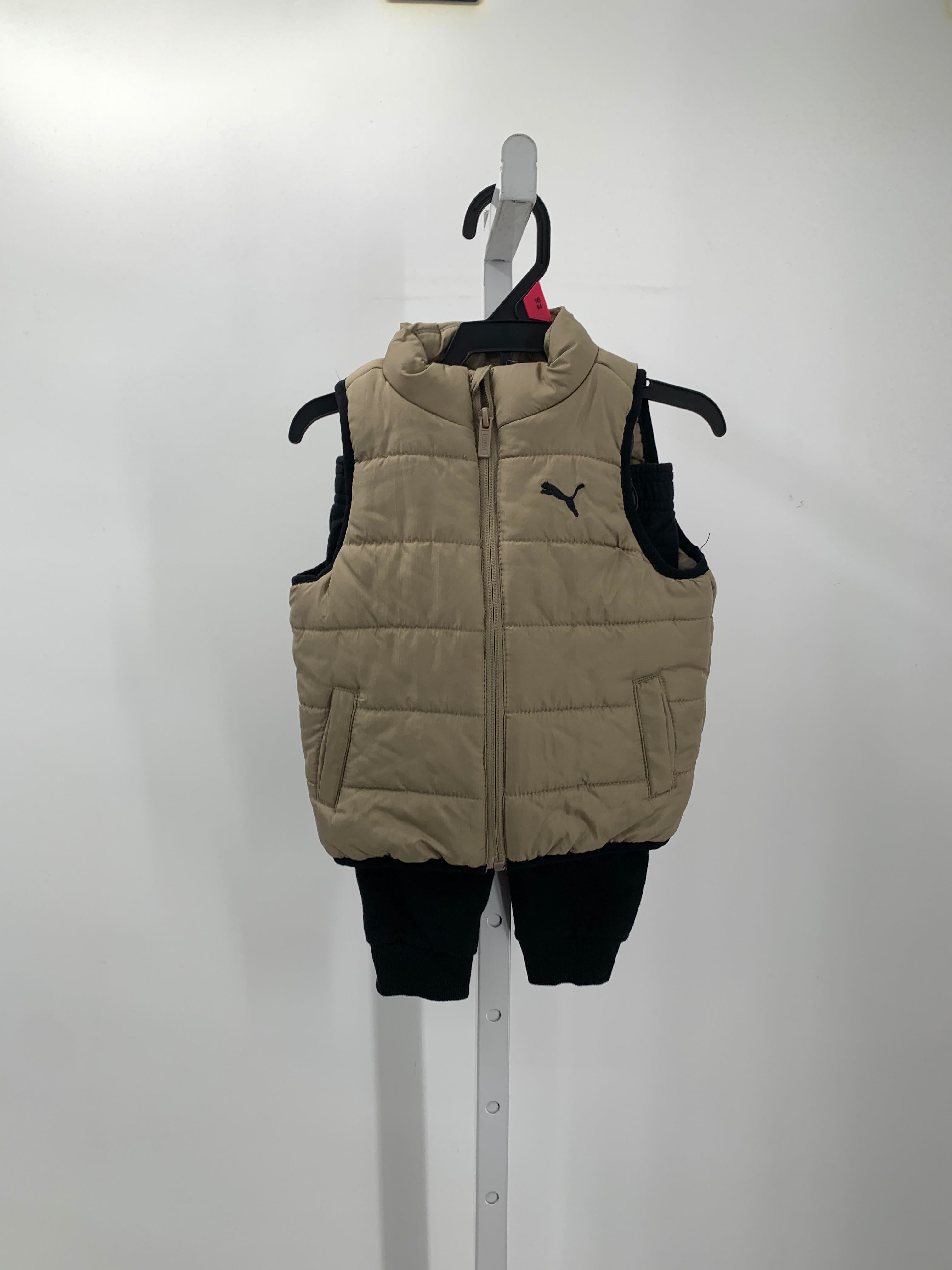 PUFF VEST AND BLACK PANTS