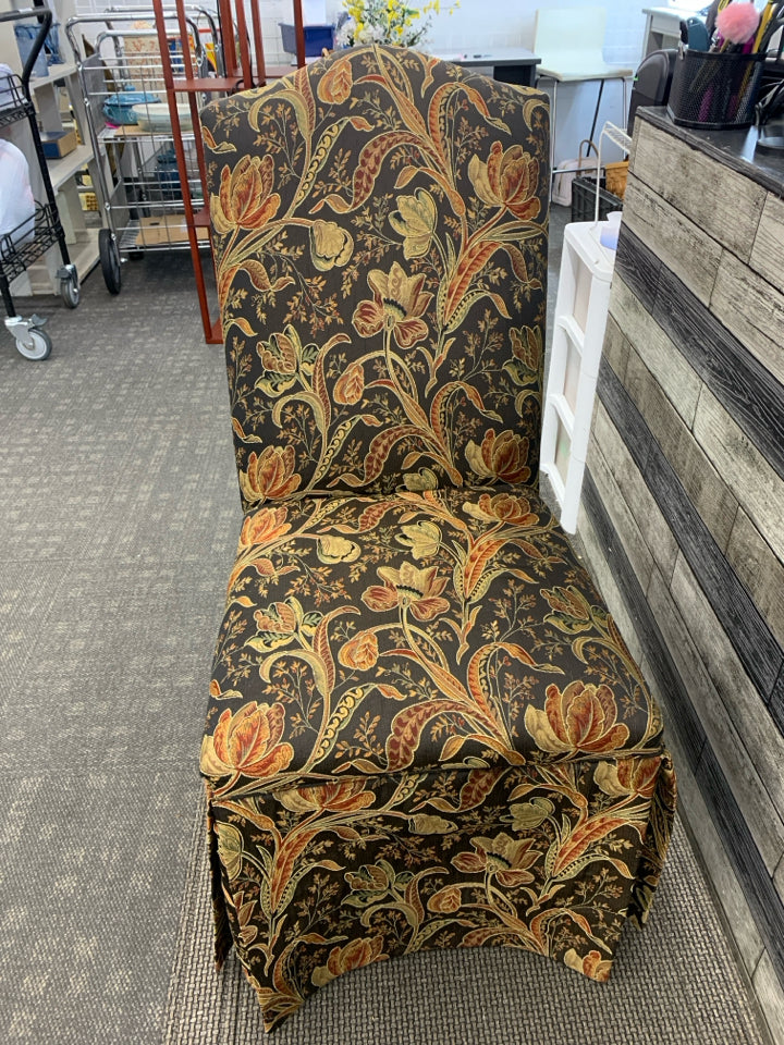 BLACK FLORAL UPHOLSTERED SLIPPER CHAIR.
