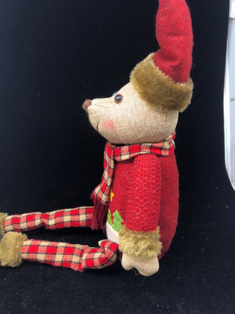 SHELF SITTING TEDDY IN RED COAT.