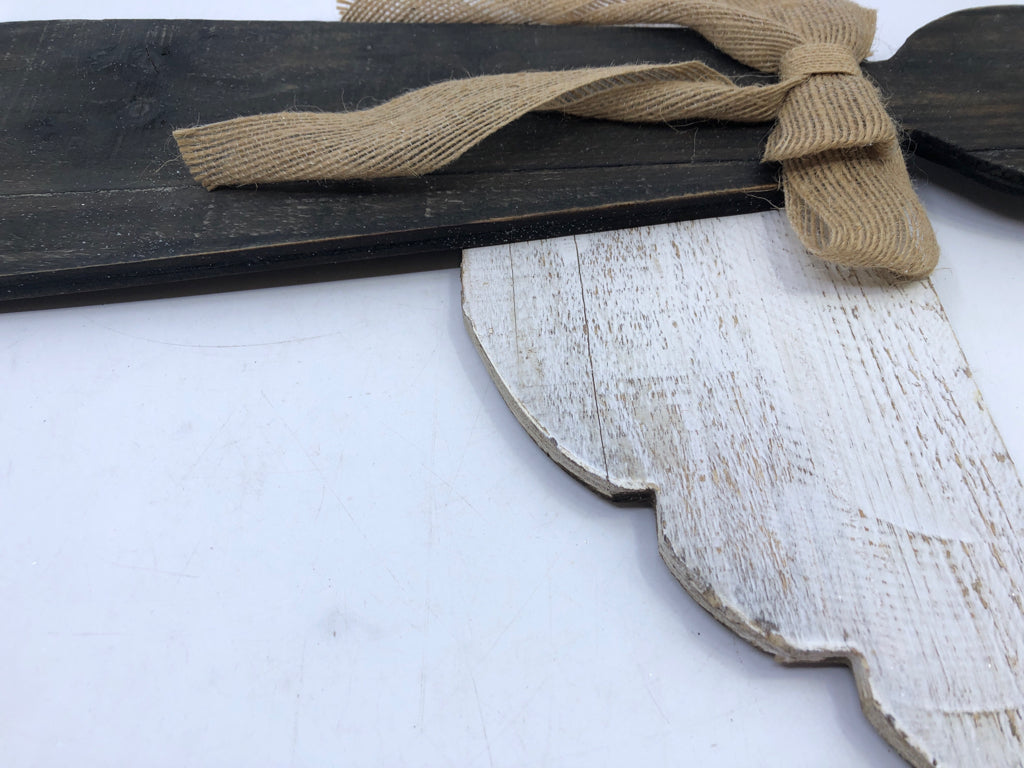 BLACK WOODEN ANGEL/WHITE WINGS & BROWN BOW WALL HANGING.