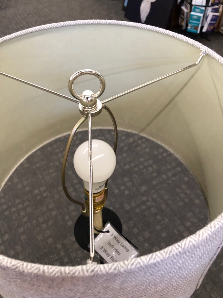 METAL FLOOR LAMP W/CURVED FEET & GRAY SHADE.