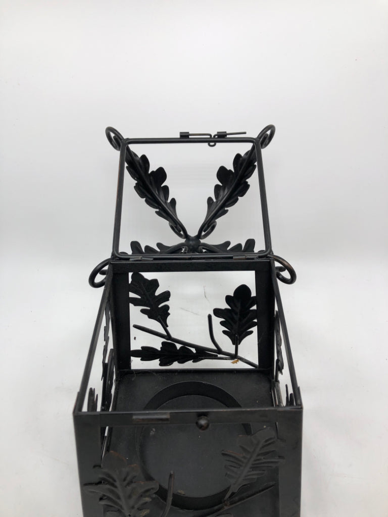 BLACK METAL LEAF EMBOSSED CANDLE LANTERN.