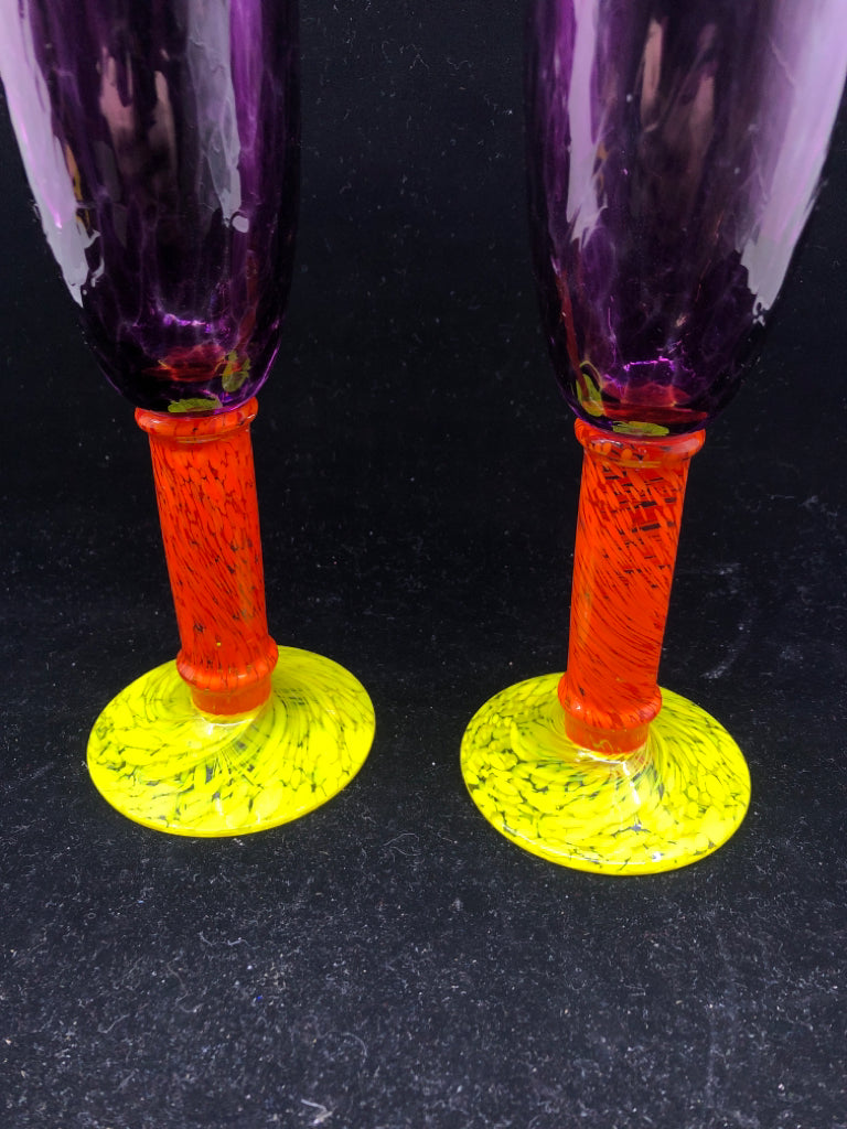 2 MULTI COLORED BLOWN GLASS CHAMPAGNE FLUTES.