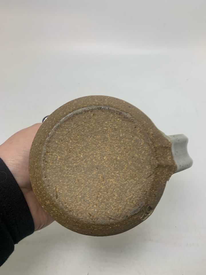 GREY SPECKLED SHORT POTTERY MUG W/ BROWN RIM.