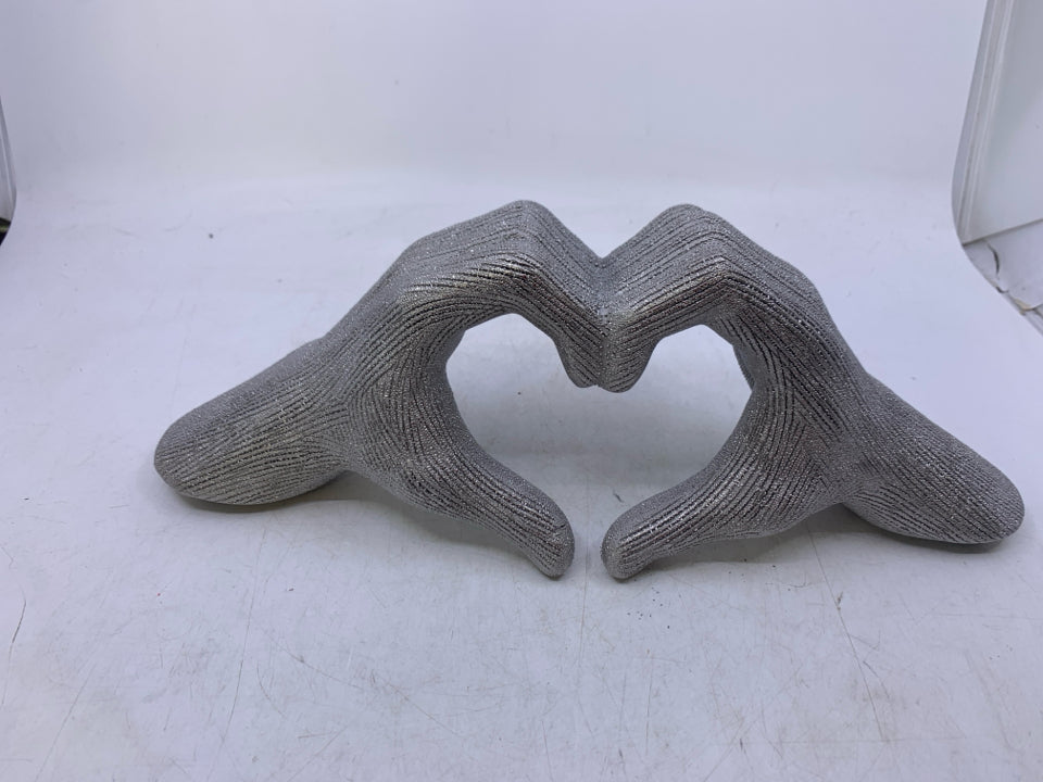 CERAMIC TEXTURED SILVER HANDS MAKING HEART SHAPED.