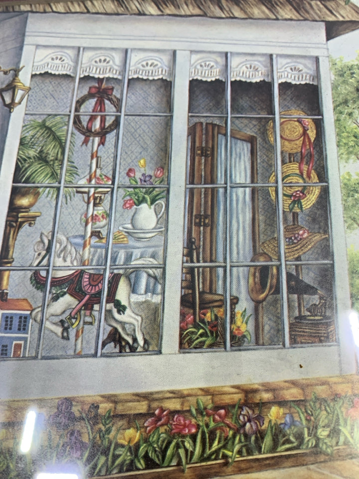 CAROUSEL SHOP PRINT IN BROWN FRAME.