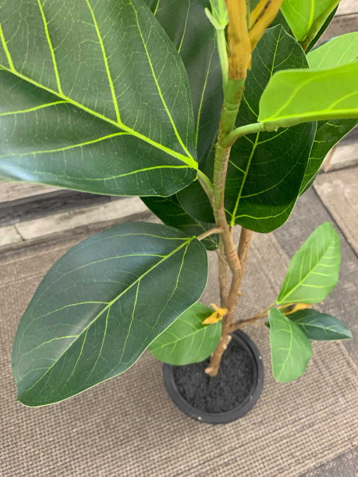 TALL FAUX PLANT IN BLACK PLANTER.