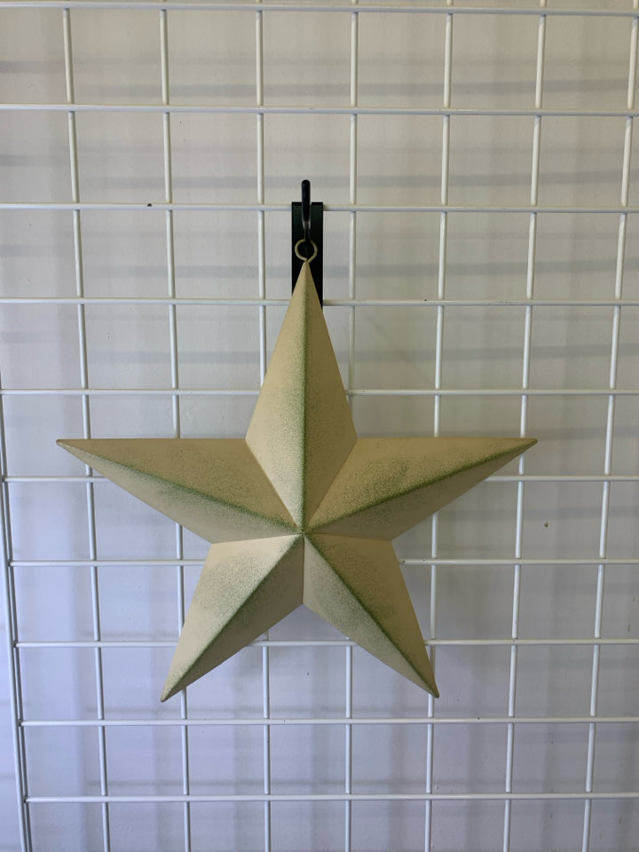 CREAM AND GREEN METAL STAR.