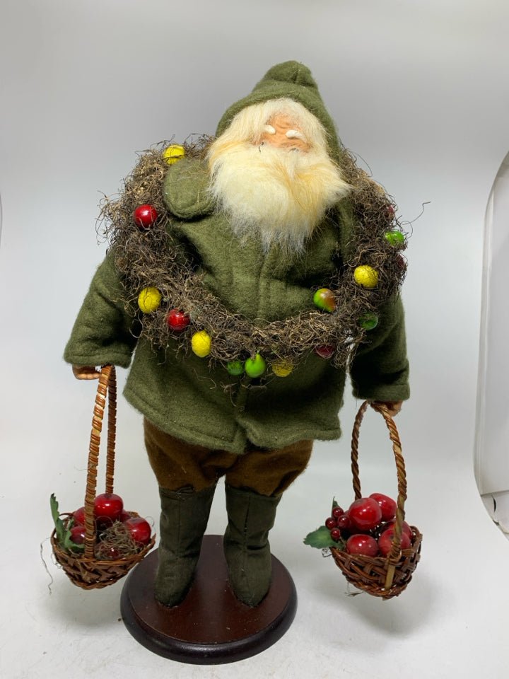 LARGE SANTA W/ GREEN SHIRT LARGE WREATH AROUND NECK HOLDING BASKET OF APPLES.