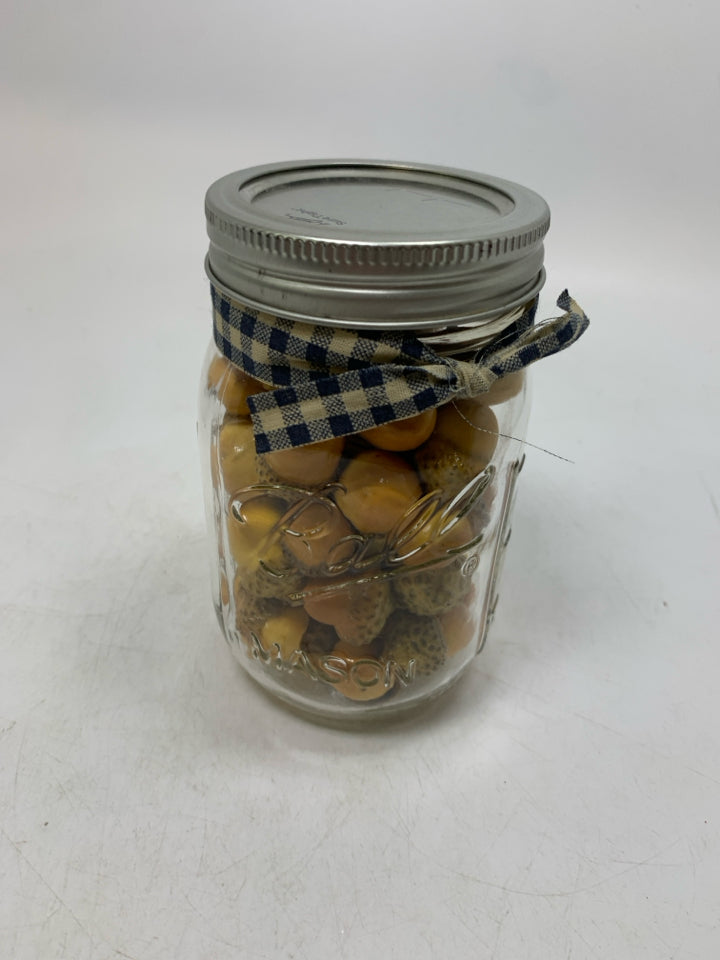 BALL JAR FULL OF FAUX ACORNS.