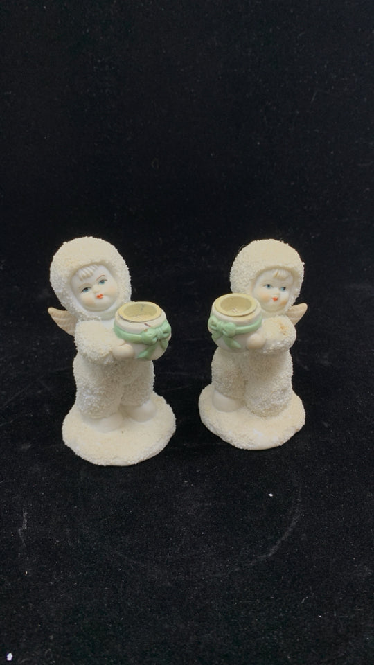 2 SNOW BABY HOLDING BOWL W/RIBBON CANDLE HOLDER.