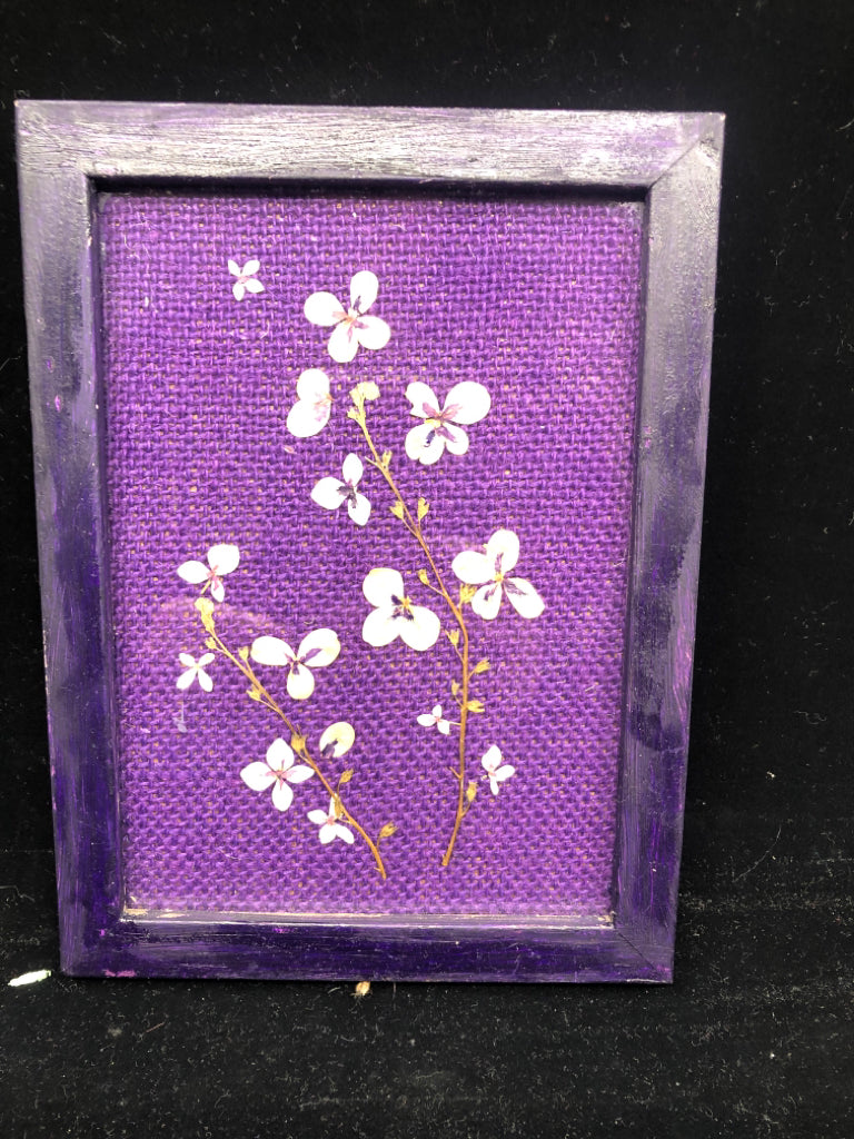 DRIED FLOWERS IN PURPLE FRAME.