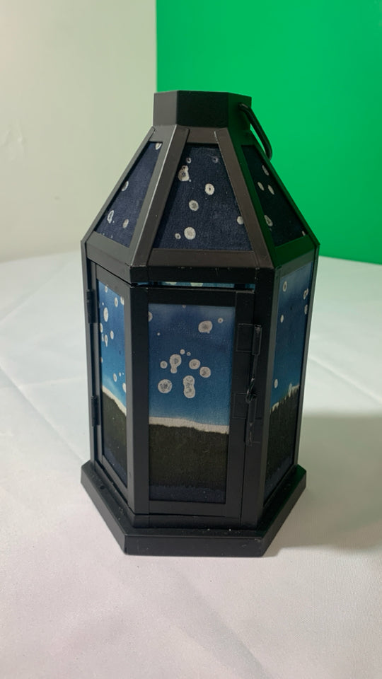 BLACK METAL HEXAGON SHAPED LANTERN W/ PAINTED PANES.