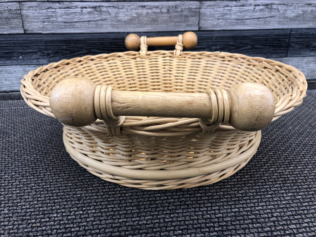 LIGHT WOVEN BASKET W 2 WOOD HANDLES.