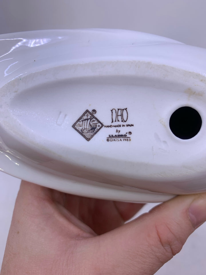 WHITE DOVE LAYING DOWN.