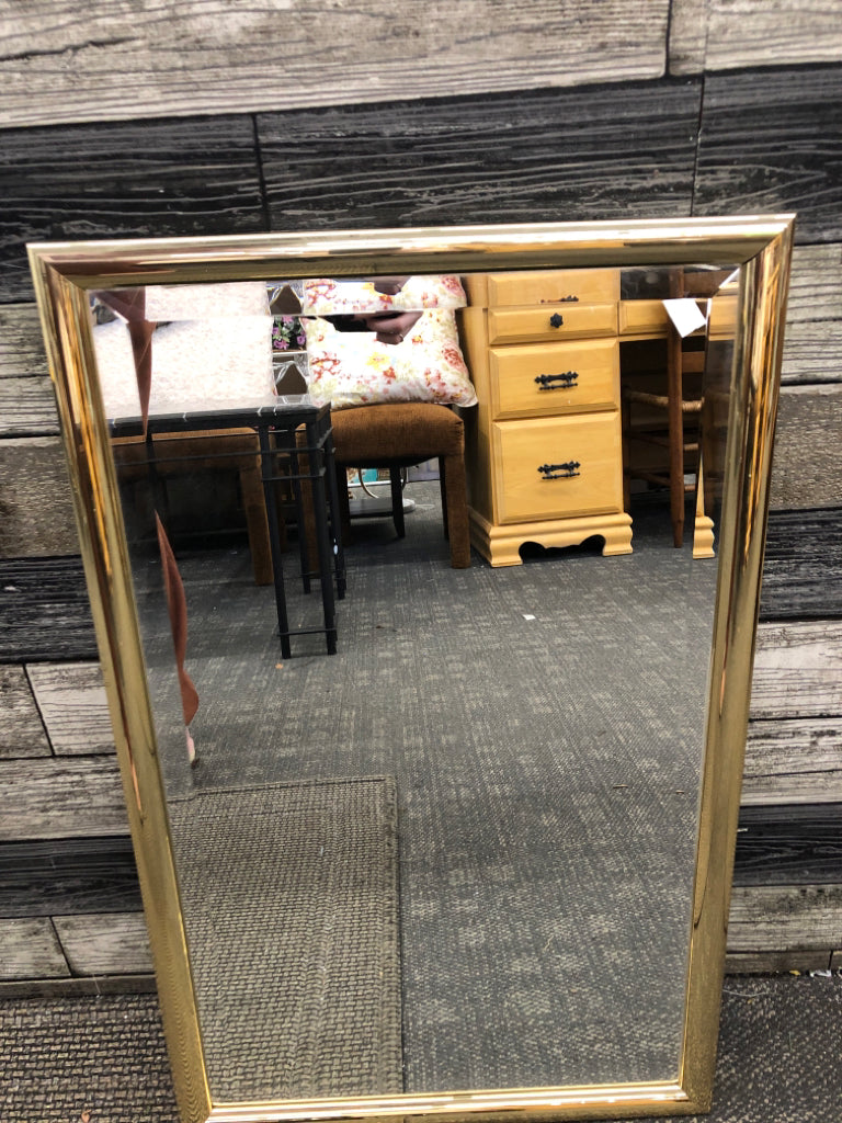 GOLD FRAMED WALL MIRROR.