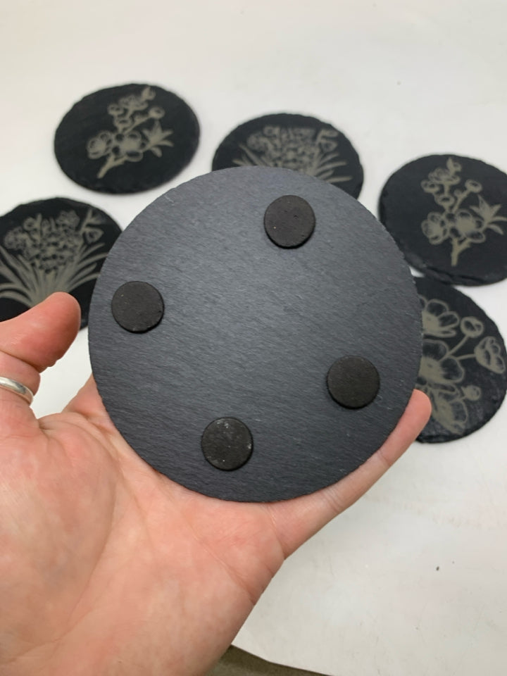 6 CIRCLE SLATE FLOWER DETAILED COASTERS IN BAG.