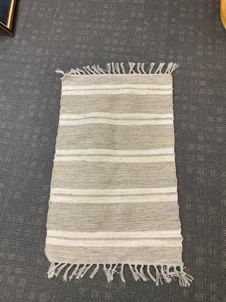 CREAM STRIPE AREA RUG W FRINGE.