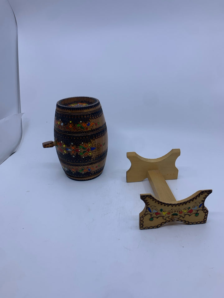 DECORATIVE CARVED/MULTI COLORED WOOD BARREL ON STAND.