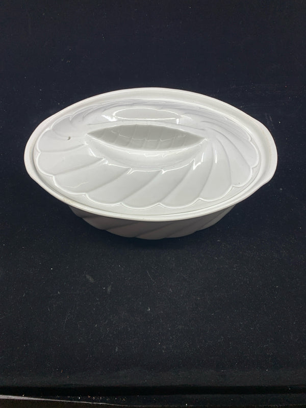 WHITE RIBBED STONEWARE OVAL COVERED CASSEROLE.