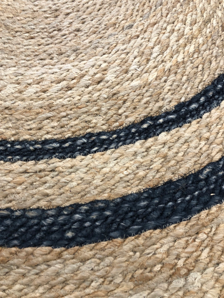 BLACK STRIPED WOVEN JUTE AREA RUG.