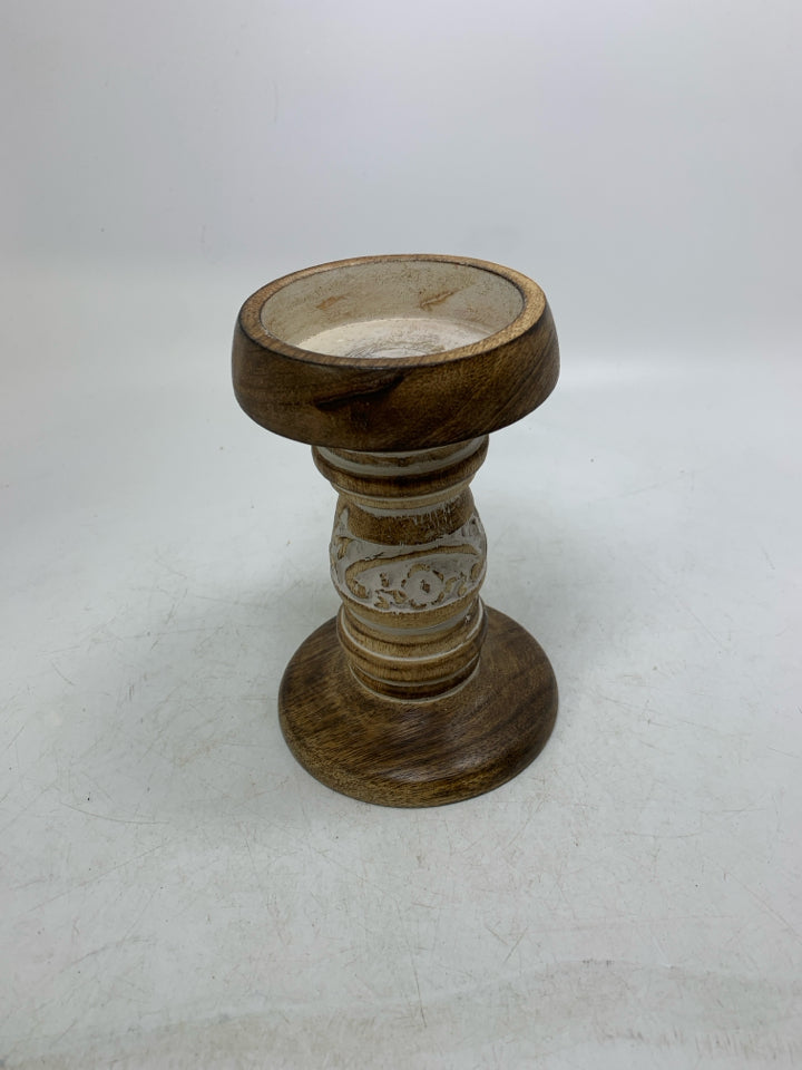 CARVED PILLAR CANDLE HOLDER W/ WHITE DETAILS.