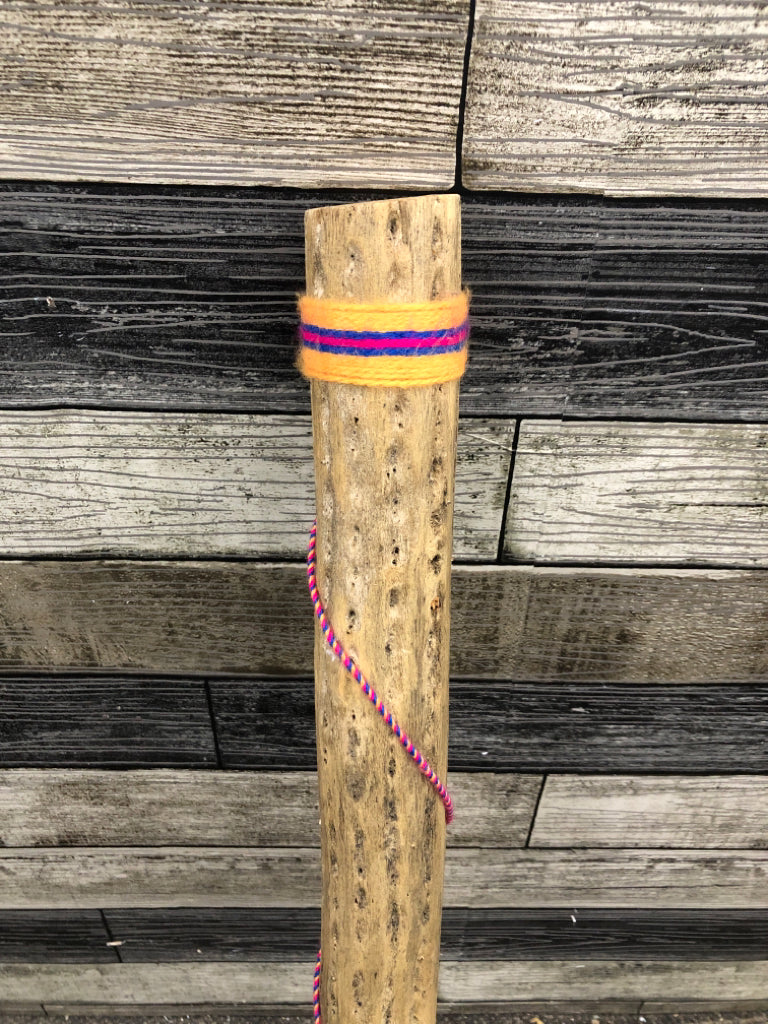 YARN WRAPPED RAIN STICK.