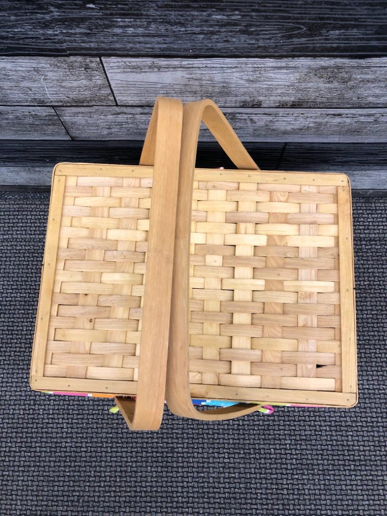 BLONDE WICKER BASKET WITH RAINBOW LINER WITH HANDLES.