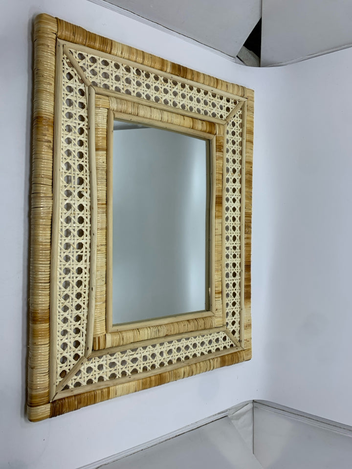 WOVEN RATTAN MIRROR.