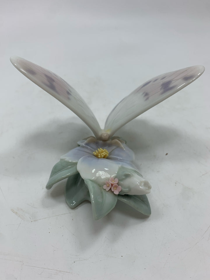 PORCELAIN BUTTERFLY ON FLOWER FIGURINE.