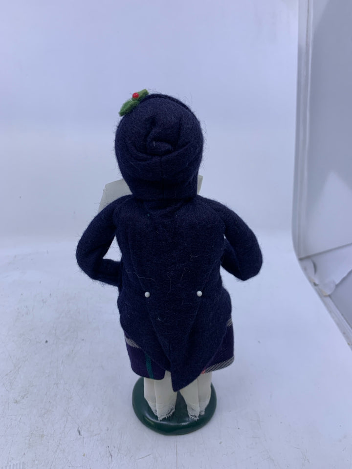 GIRL CAROLER W/ DARK BLUE COAT HOLDING BELL 1988 BYERS' CHOICE.