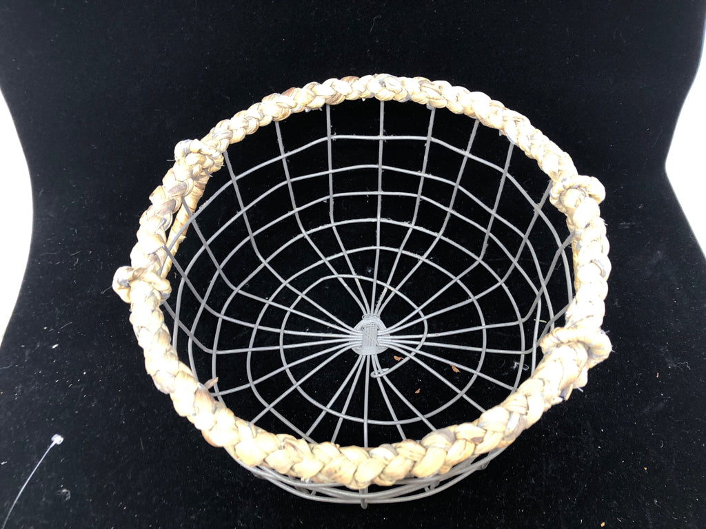 METAL ROUND BASKET W WOVEN HANDLES AND RIM.