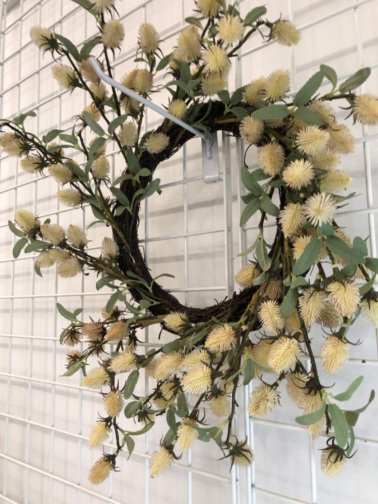 CREAM THISTLE BLOOMS W/GREEN LEAVES WREATH.